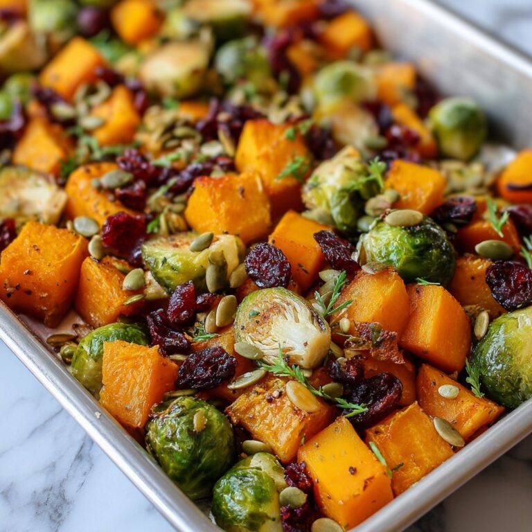Roasted Butternut Squash & Brussels Sprouts with Maple, Cranberries, and Pumpkin Seeds Recipe