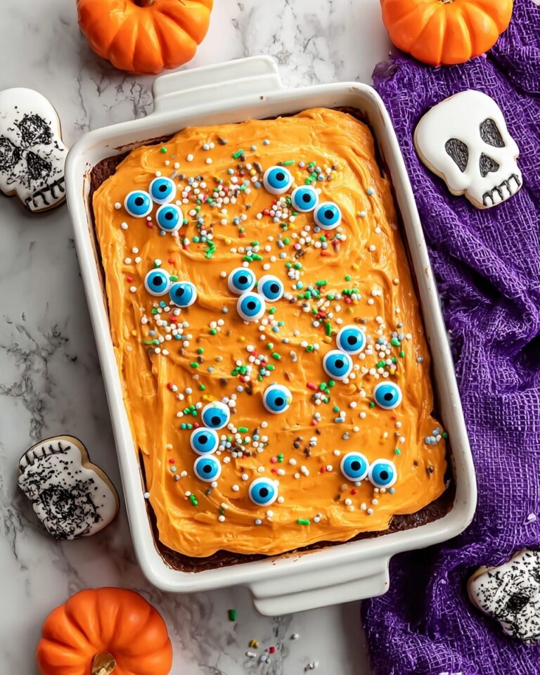 Halloween Cinnamon Rolls with Orange Cream Cheese Frosting and Festive Toppings Recipe